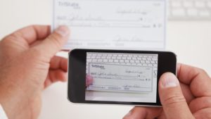 Customer photo of check deposit on mobile device.